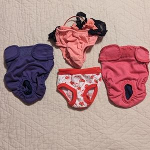 Dog panties are small and medium, there are four pairs, pink, purple & red.